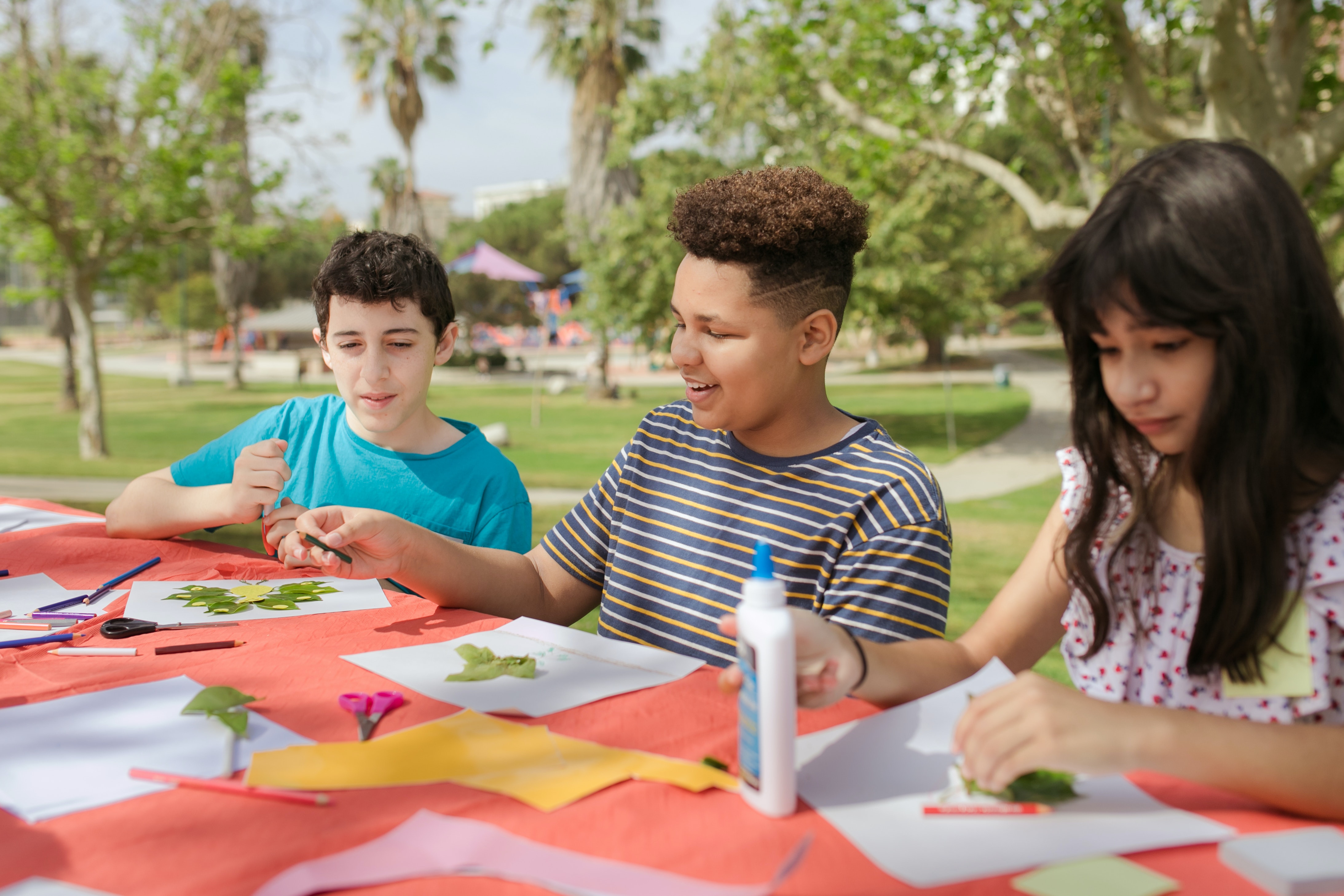 Children work on STEM activity at table