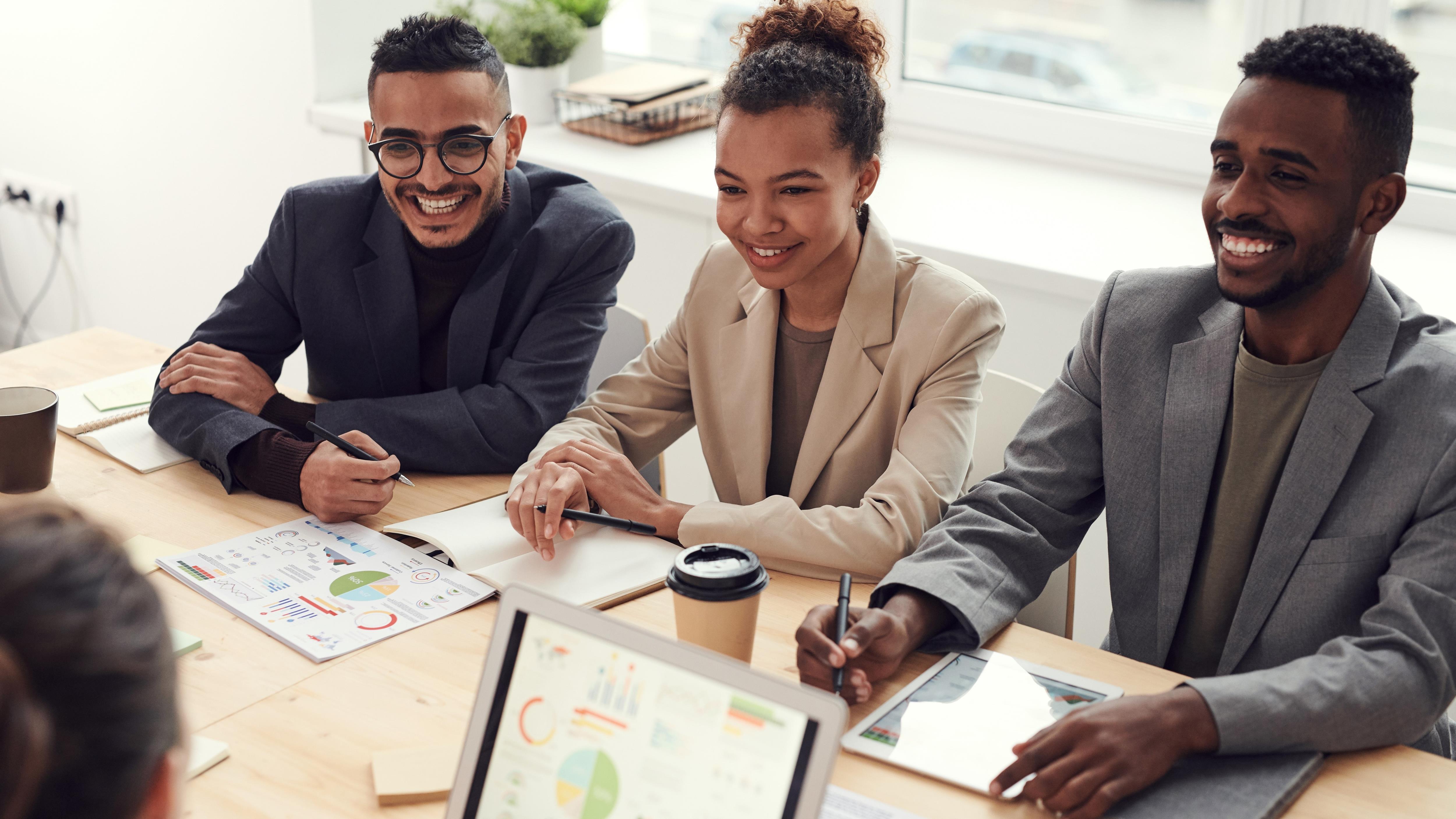 three business people in a meeting